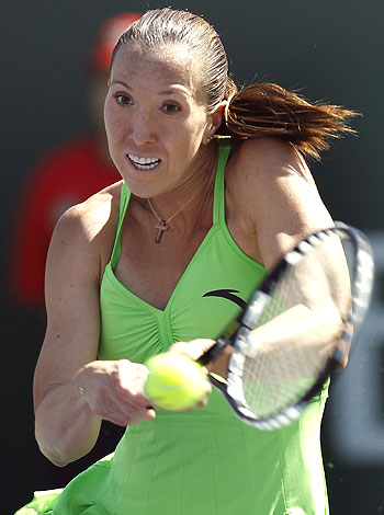 Jelena Jonkovic hits a return against Alisa Kleybanova