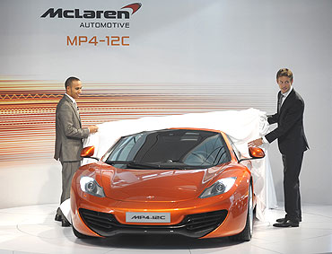 Lewis Hamilton (left) and Jenson Button unveil the new McLaren Automotive MP4-12C car