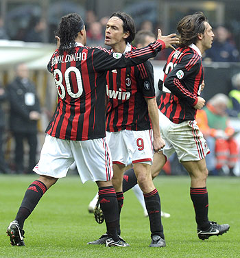 AC Milan's Filippo Inzaghi (centre) celebrates with his teammates Ronaldinho (left) and Andrea Pirlo