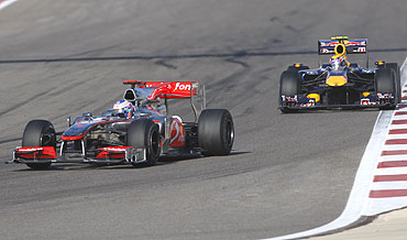 McLaren's Jenson Button leads Red Bull's Mark Webber during the Bahrain GP