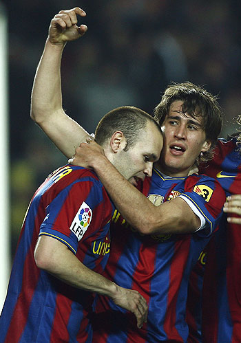 Barcelona's Bojan Krkic (right) and Andres Iniesta celebrate the second goal against Osasuna