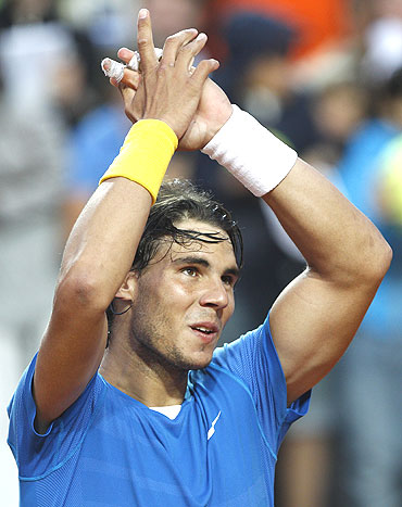 Rafael Nadal of Spain reacts after beating Stanislas Wawrinka