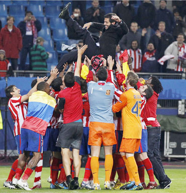 Atletico Madrid's players celebrate after their win over Fulham