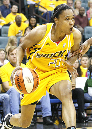 Tulsa Shock guard Marion Jones drives against the Minnesota Lynx