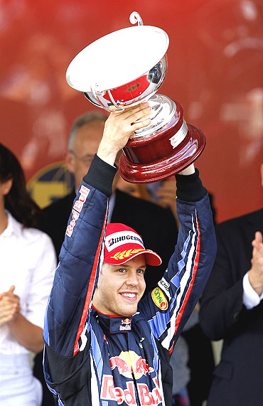 Red Bull's Sebastian Vettel with his trophy after finishing second