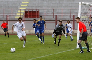 An extra linesman behind the goal