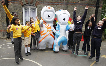 Mascots play with students from St. Paul's primary school