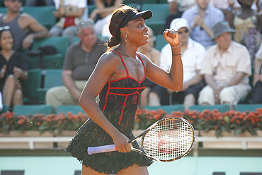 Venus Williams of the US celebrates winning her match against Patty Schnyder of Switzerland