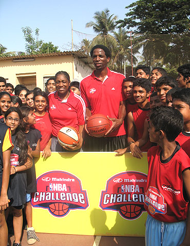 Former WNBA champion Teresa Edwards (left) and AC Green with participants at the Mahindra NBA challenge in Mumbai
