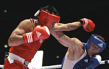 Vijender Singh (left) in action during a bout in Milan