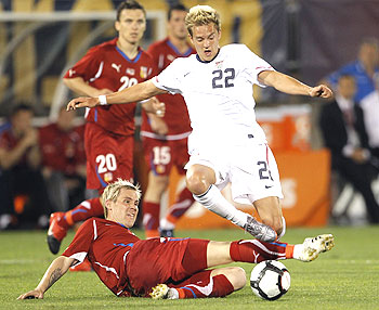 Czech Republic's Tomas Hubschman (bottom) tackles the Stuart Holden of the US during a football friendly on Tuesday