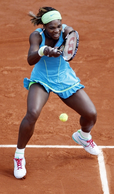 Serena Williams returns the ball to Goerges