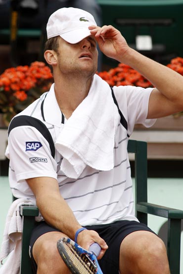 Andy Roddick reacts after losing the match