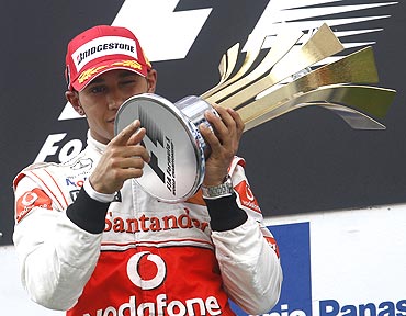 Lewis Hamilton with the trophy