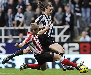 Sunderland's Phil Bardsley (right) challenges Newcastle United's Andy Carroll on Sunday