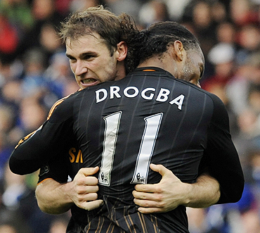 Chelsea's Branislav Ivanovic (left) celebrates scoring with Didier Drogba against Blackburn Rovers on Saturday
