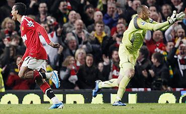 Manchester United's Nani (left) celebrates after scoring as Tottenham Hotspur's goalkeeper Heurelho Gomes (right) appeals to the referee on Saturday