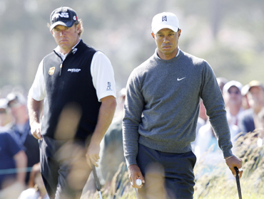 Tiger Woods (R) of the U.S. and Lee Westwood of Britain