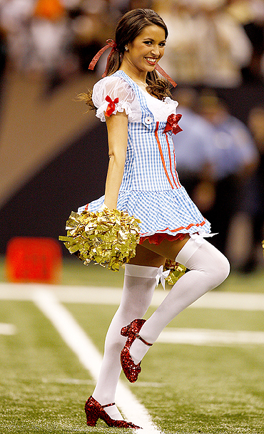 A New Orleans Saintsations dancer, dressed as the character of Dorothy Gale from the movie 'The Wizard of Oz', smiles during the New Orleans Saints NFL football game against the Pittsburgh Steelers in New Orleans, Louisiana on Sunday