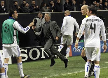 Real Madrid coach Jose Mourinho reacts after Pedro Leon scores the equalising goal against AC Milan