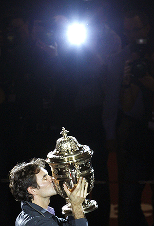 roger federer with the Swiss Indoor trophy