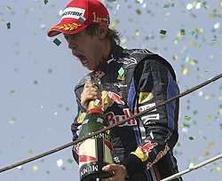 Sebastian Vettel celebrates after winning the Brazilian GP