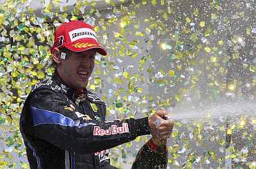 Sebastian Vettel celebrates after winning Brazil GP