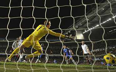 Chelsea's Michael Essien scores past Fulham's goalkeeper Mark Schwarzer during their English Premier League match