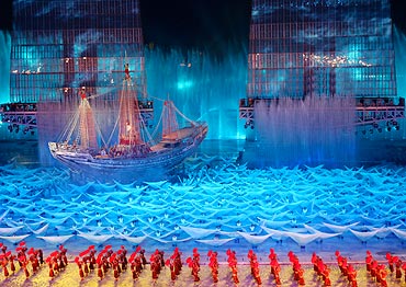 Participants perform during a rehearsal for the opening ceremony of the Asian Games in Guangzhou