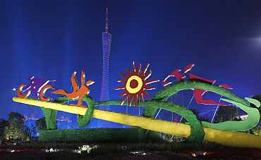Sports sculptures are pictured in front of the Guangzhou TV Tower