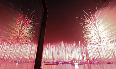 Fireworks explode at the Pearl river during the opening ceremony