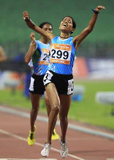 Preeja Sreedharan celebrates after winning the women's 10,000m final