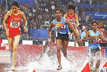 India's Sudha Singh runs during the women's 300m steeplechase at the 16th Asian Games in Guangzhou