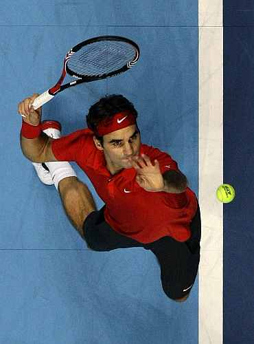 Roger Federer serves during his match against Andy Murray at the ATP World Tour Finals in London
