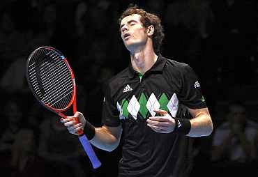 Andy Murray reacts after missing a point during the ATP World Tour Finals in London