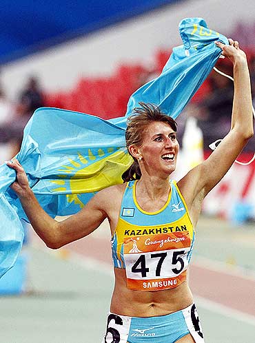 Kazakhstan's Margarita Matsko celebrates winning the women's 800m final at the 16th Asian Games in Guangzhou
