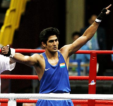 Vijender Singh wins the gold medal in the men's 75kg boxing event at the 16th Asian Games