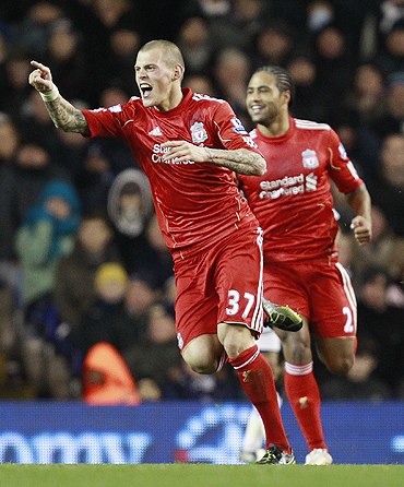 Liverpool's Martin Skrtel (left) celebrates after netting against Tottenham Hotspurs on Sunday