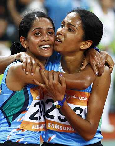 Preeja Sreedharan celebrates after winning the women's 10,000m final with Kavita Raut