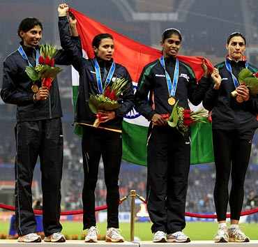 India's women's 4x400m relay team stand with their gold medals