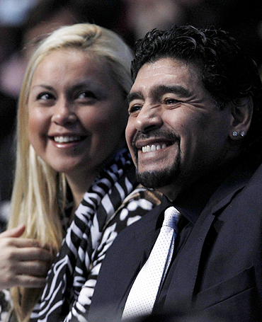 Former Argentine soccer star Diego Maradona and girlfriend Veronica Ojeda watch the finals between Rafael Nadal and Roger Federer at the ATP World Tour Finals in London on Sunday
