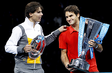 Rafael Nadal (left) congratulates Roger Federer following their final at the ATP World Tour Finals in London on Sunday