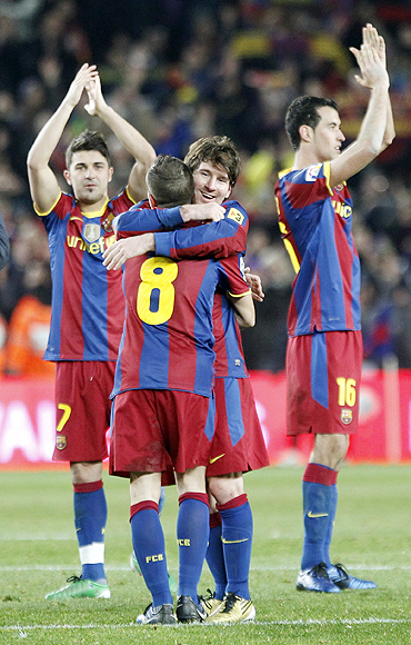 Barcelona's players celebrate after defeating Real Madrid at Nou Camp on Monday