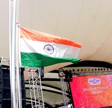 Indian tri-colour being hoitsted at Games Village