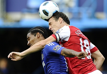 Chelsea's Florent Malouda challenges Arsenal's Sebastien Squilacci during their English Premier League match