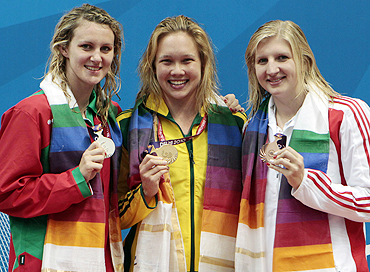 Gold medallist Kylie Palmer (centre) poses with silver medallist Jazmin Carlin (left) and bronze medallist Rebecca Adlington after winning the women's 200m freestyle swimming final