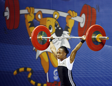 Augustina Nkem Nwaokolo of Nigeria competes in the women's 48kg weightlifting competition