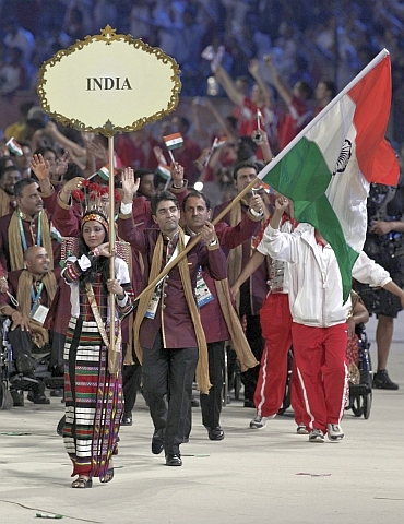 Abhinav Bindra walks with the Indian contingent at Nehru Stadium