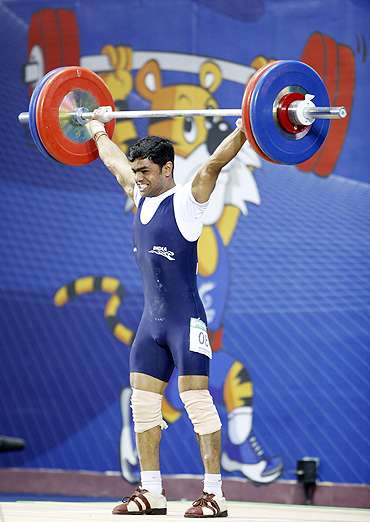 Rustam Sarang of India competes in the men's 62kg weightlifting competition