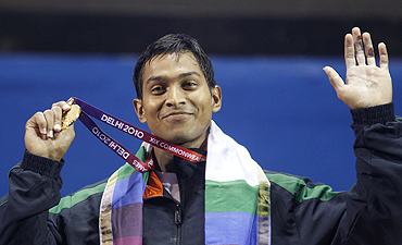 K Ravi Kumar shows off his gold medal